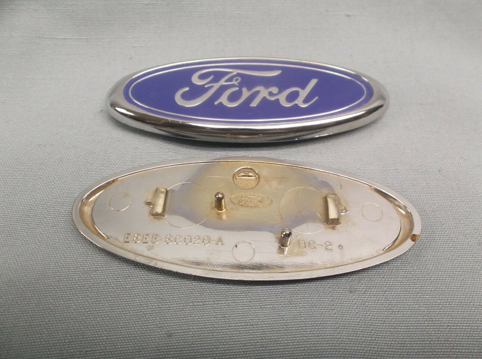 O.e.m. Ford E8eb-80020-a Emblem Oval Blue Silver 1 1/2" X 4"  Size Imperfections