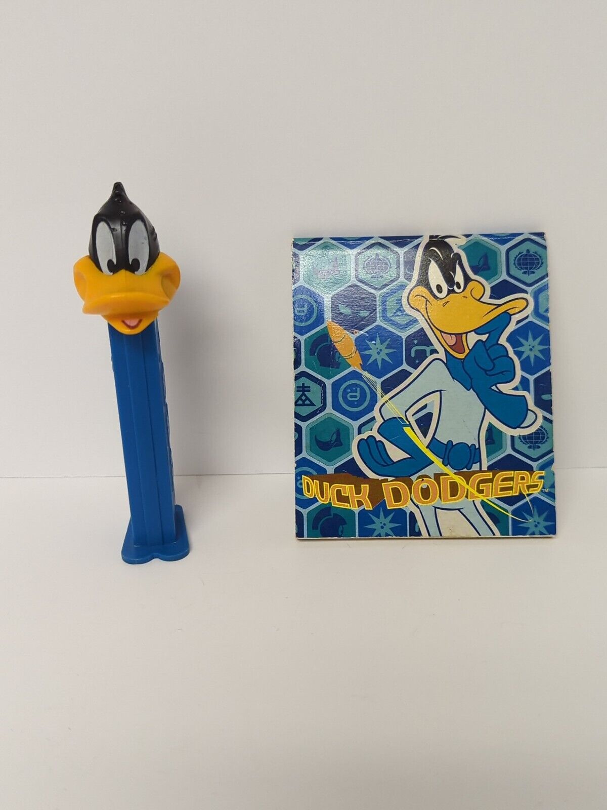 1993 Warner Bros Looney Tunes Daffy Duck PEZ dispenser and duck dodgers notebook